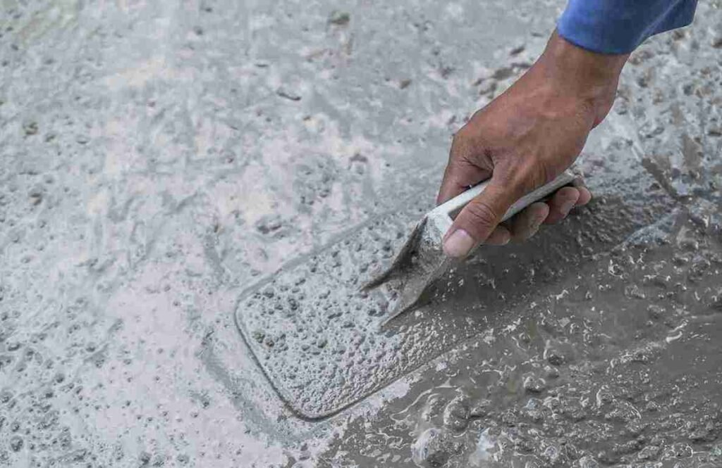 Applying concrete resurfacer to repair damaged surface in North Royalton OH.