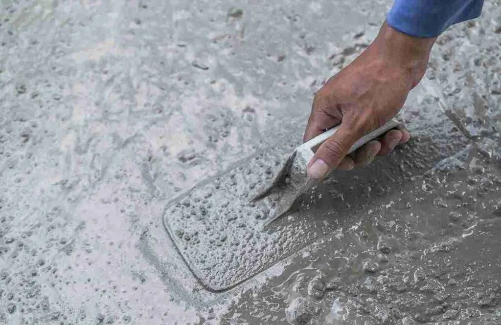 Applying concrete resurfacer to repair damaged surface in North Royalton OH.