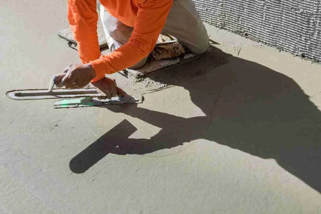 Contractor smoothing fresh concrete surface during resurfacing in North Royalton OH.