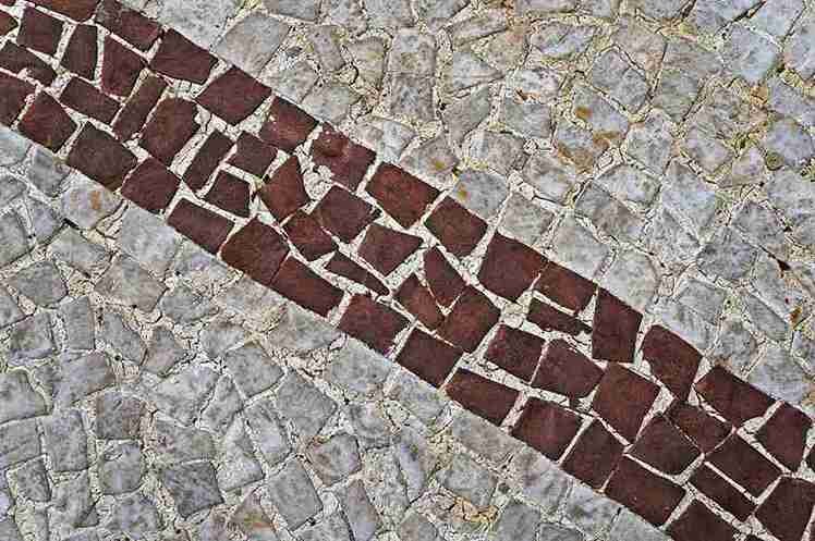 Decorative stamped concrete with red brick and stone border design in North Royalton OH.