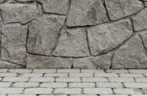 Close-up of textured stamped concrete wall and stone-patterned surface showing realistic design detail in North Royalton OH.